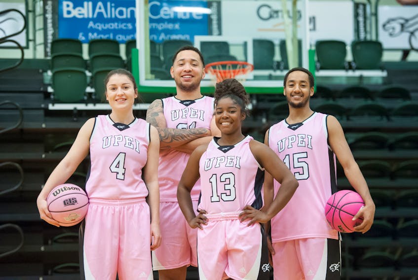 The UPEI Panthers women's basketball team is hosting its annual Shoot for the Cure game Saturday night. The men's team is also showing their support for the initiative. From left Jenna Mae Ellsworth, Vernelle Johnson, Kimeshia Henry and Amin Suleman.