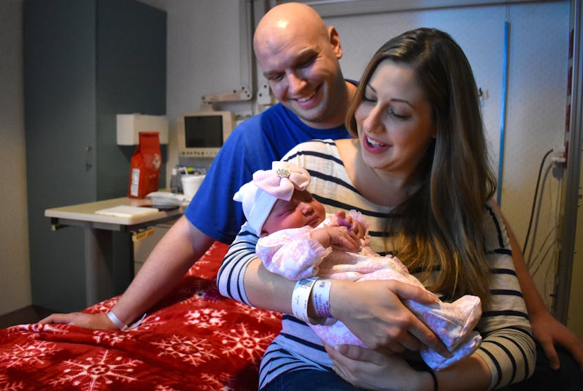 Andrew and Amanda Burke talk to their daughter, Alexia Jacqueline. Weighing eight pounds and six ounces, Alexia was the first baby born in Nova Scotia in 2018, arriving at 12:06 a.m. on Monday.