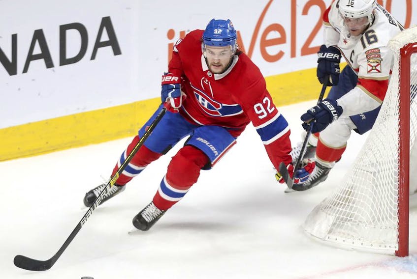 Montreal Canadiens' Jonathan Drouin holds off Florida Panthers Aleksander Barkov during second period in Montreal on Jan. 15, 2019.