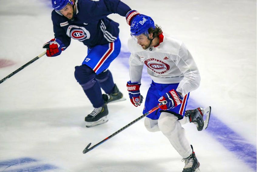 Ben Chiarot, rear, pursues Josh Anderson during Montreal Canadiens practice at the Bell Sports Complex in Brossard on Jan. 27, 2021. 