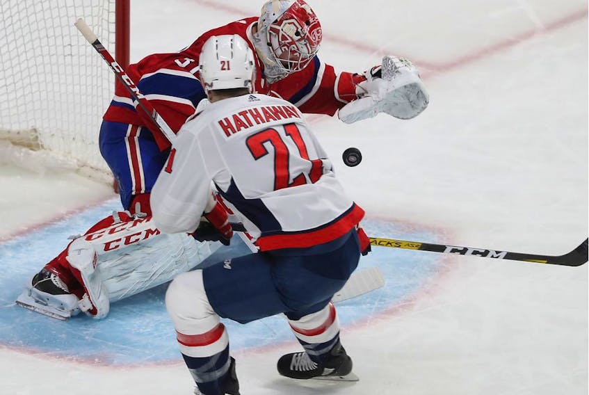 Montreal Canadiens goaltender Carey Price stops shot by Washington Capitals' Garnet Hathaway (21) during the second period in Montreal on Monday January 27, 2020. 