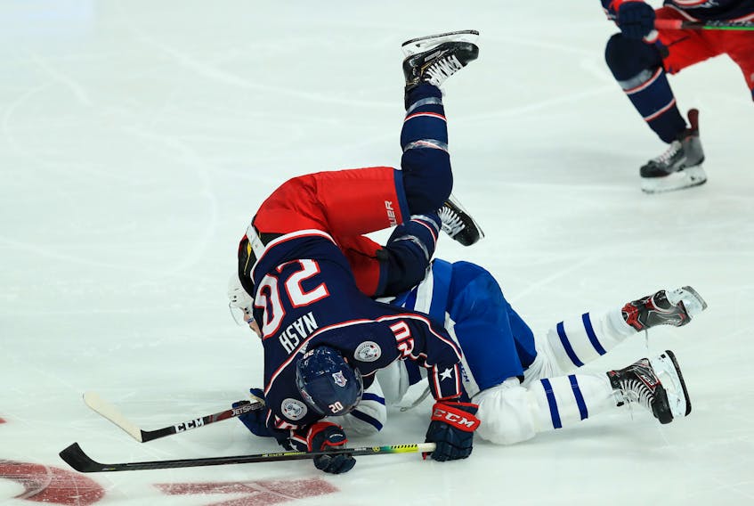Columbus Blue Jackets centre Riley Nash collides with Toronto Maple Leafs centre Auston Matthews earlier this season.