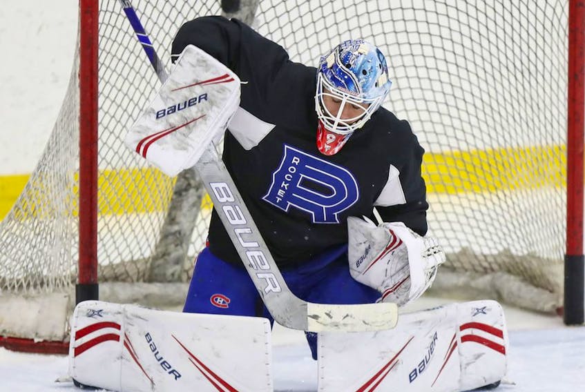 Laval Rocket goalie Michael McNiven makes a save during practice in Laval on March 3, 2020. 