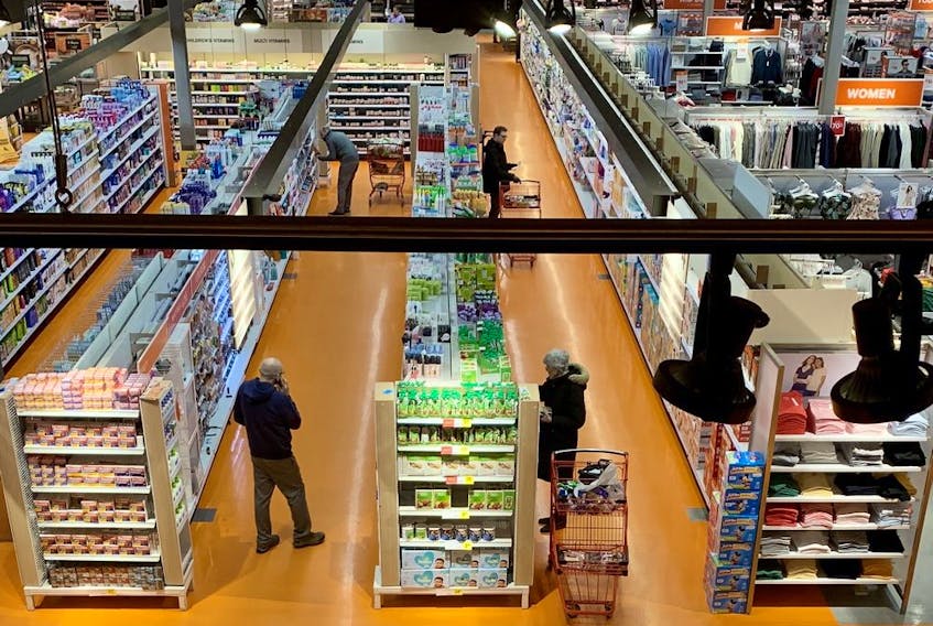 Grocery shoppers exercise physical distancing in an Ottawa store.