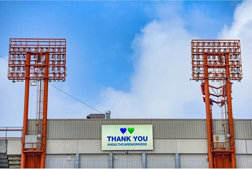  Signs on the McMahon Stadium send a thank-you to the health workers during the Coronavirus pandemic earlier this month. Photo by Azin Ghaffari/Postmedia.