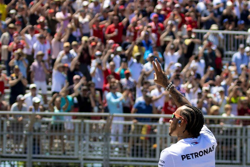 Mercedes driver Lewis Hamilton waves to the crowd during the drivers' parade at the Canadian Grand Prix  in Montreal on June 9, 2019. 