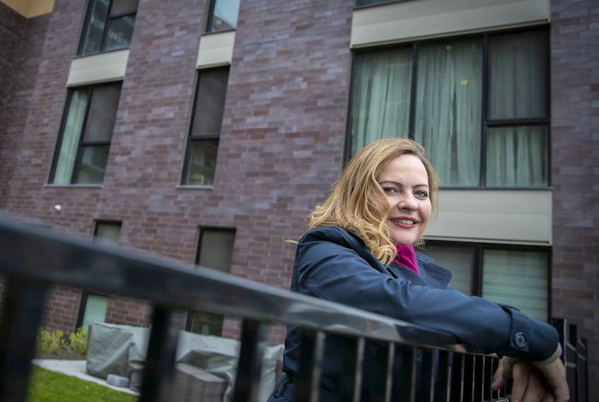 Laurie Murphy, president of Gestion Griffin, a company that manages common areas of condo towers, outside a Griffintown complex in Montreal on Friday, May 15, 2020.