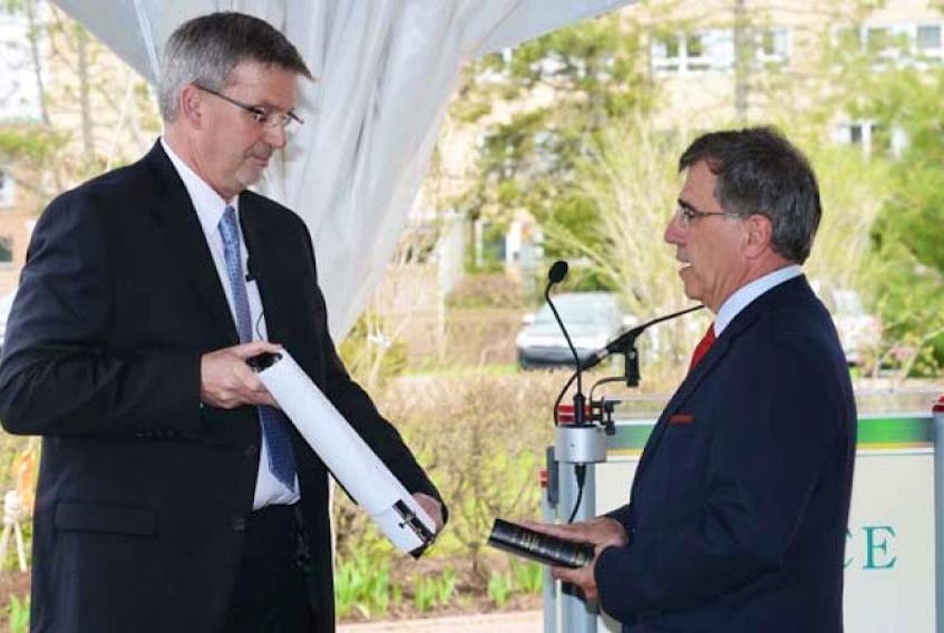 <p>Brian Douglas, Clerk of the Executive Council, swears in Richard Brown as Minister of Workforce and Advanced Learning.&nbsp;</p>