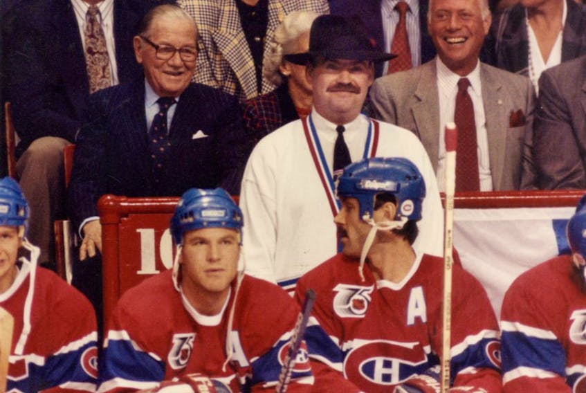 Canadiens coach Pat Burns wears a fedora behind the bench during game at the Montreal Forum in 1991.

