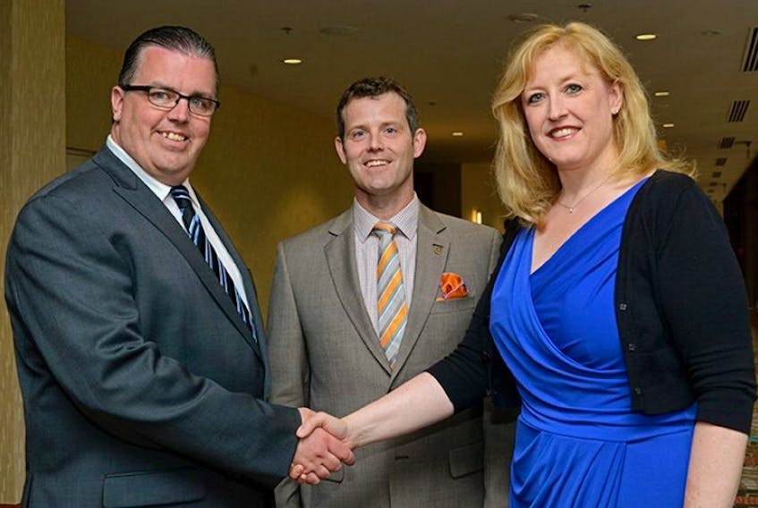 <p>Progressive Conservative party leader Steven Myers, left, is joined by party president Blake Doyle in welcoming Member of Parliament Lisa Raitt, federal Minister of Labour to the P.E.I. party's annual spring fundraising dinner. The event was held Friday, May 31, 2013 at the Delta Prince Edward in Charlottetown.</p>