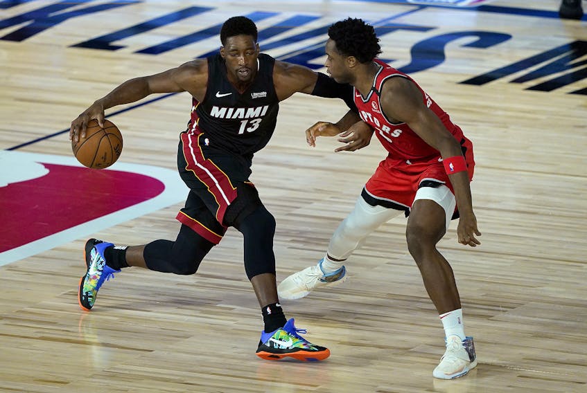 Bam Adebayo of the Miami Heat is defended by Raptors' OG Anunoby during Monday's game.