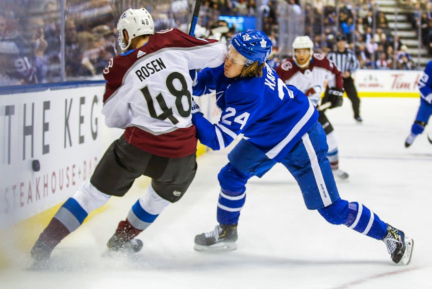 Toronto Maple Leafs' Kasperi Kapanen takes an elbow from Colorado Avalanche defenceman Calle Rosen during Wednesday's game at the Scotiabank Arena. (Ernest Doroszuk/Toronto Sun)