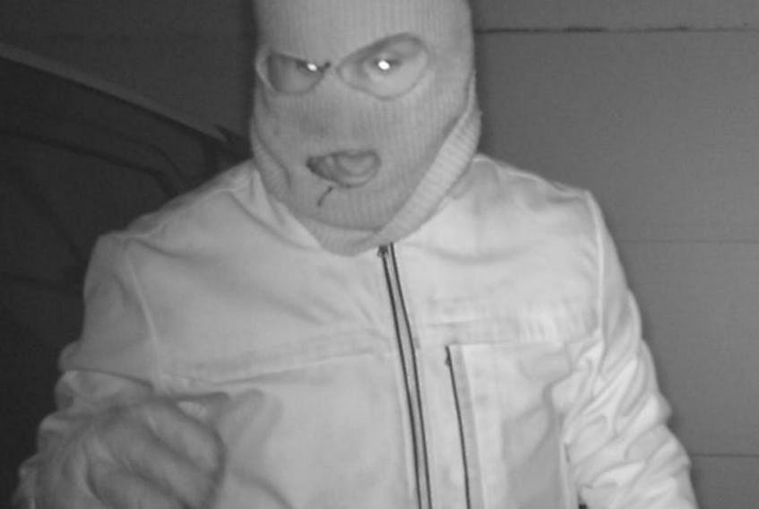 The RCMP released this security camera photo of a man breaking into a home in the Stratford area.