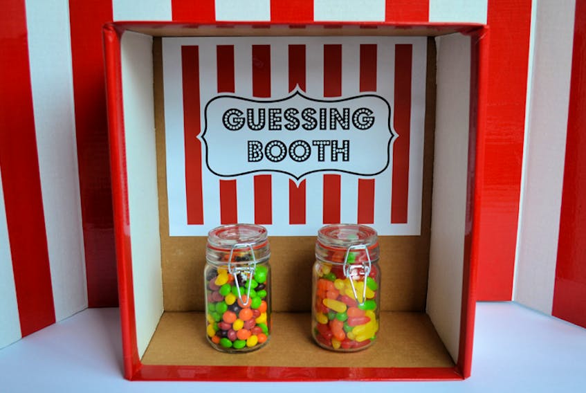 This homemade guessing booth, for an upcoming carnival-themed birthday party, is an inexpensive way to make a big impact.