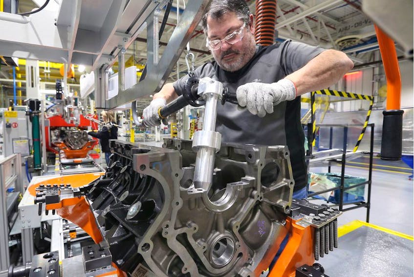 Ford team leader Rino Fanella works on the new, 7.3L V-8 engine at Ford Windsor Engine Plant Annex site Feb. 7, 2019.
