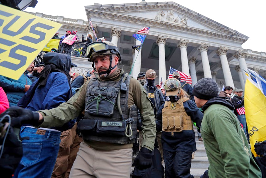 Members of the Oath Keepers are seen among supporters of U.S. President Donald Trump at the U.S. Capitol during a protest against the certification of the 2020 U.S. presidential election results by the U.S. Congress. - REUTERS/Jim Bourg