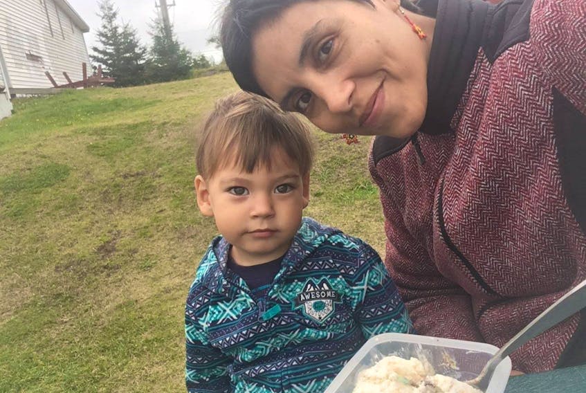 Viviana Ramírez Luna and her son Nathan enjoying ice cream using their own containers and spoons.