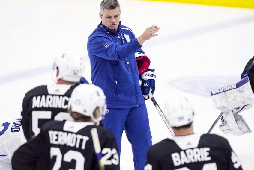 Toronto Maple Leafs' head coach Sheldon Keefe instructs the team on the next drill during the second day training camp in Toronto on Tuesday, July 14. 