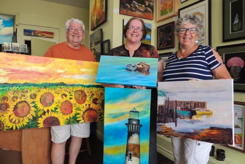 Painters St. Clair Prest, Sheila Green and Carolyn Vienneau gathered at the Art2Sea Gallery on Water Street in Pictou to provide a sneak peak of some of their works which will be on display at the annual Pictou County Artists Association show and sale opening Sept. 1 at Northumberland Fisheries Museum.