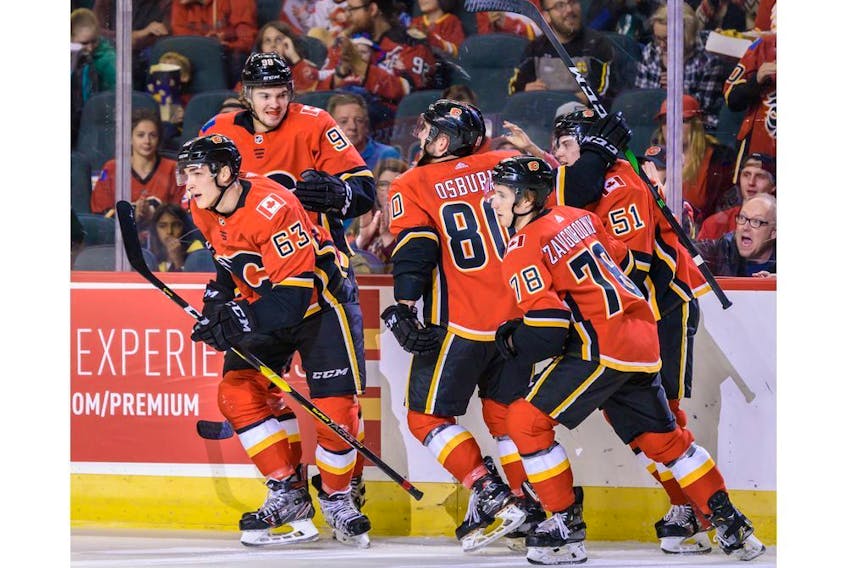 The Calgary Flames' Matthew Phillips celebrates a goal assisted by Jakob Pelletier against the Edmonton Oilers during the Battle of Alberta prospects game at Scotiabank Saddledome in Calgary on Tuesday, Sept. 10, 2019. The Flames won 3-1. Azin Ghaffari/Postmedia Calgary