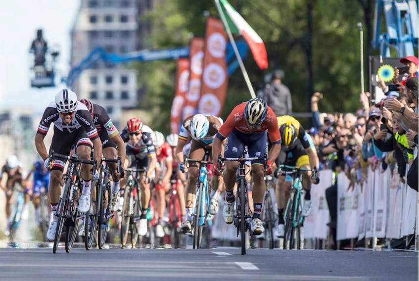 Team Sunweb's Michael Matthews (far left) comes in to the finish line to win the Grand Prix Cyclistes de Montreal cycling race in 2018.