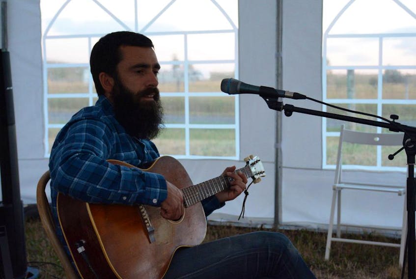 Michael Bernard Fitzgerald plays in the Greenbriar tent on a farm outside of Fort MacLeod for the Pincher Creek stop of his Farm Tour on Thursday, Sept. 3. Photo by Riley Cassidy
