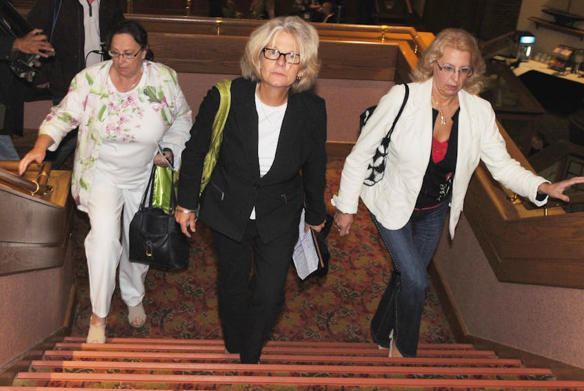 From left, Cora Plourd, Susan Holmes and Svetlana Tenetko, gathered at the Delta Prince Edward in Charlottetown for a news conference outlining their allegations of fraud and bribery in the Provincial Nominee Program in 2011. -Guardian file photo