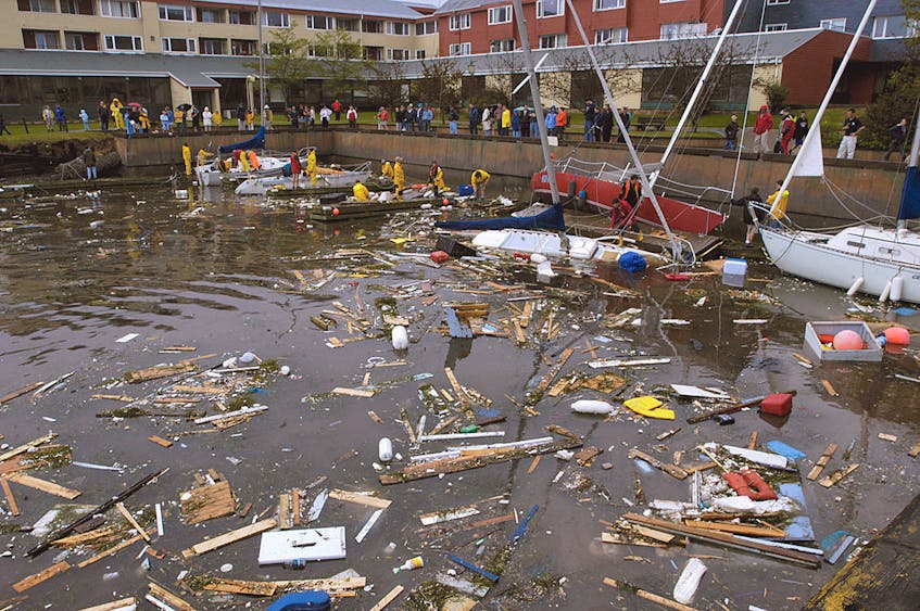 Yacht owners and club members spent the next day attempting to salvage anything they could from vessels smashed into the seawall at the Charlottetown Yacht Club Monday, Sept. 29, 2003, after Hurricane Juan. -Guardian file photo
