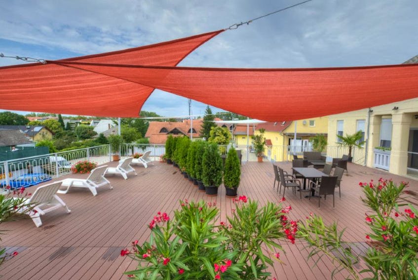 Shade sails like these offer an easy way to add protection from the sun and rain to your backyard or deck.  
