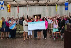 ['<p>Santa’s Angels volunteers accept the donation from 100 Women Who Care P.E.I. Chapter members Valerie Docherty and Kathleen Casey.</p>']
