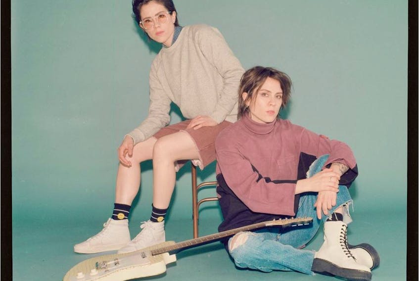 Sara Quin (on chair) and Tegan Quin of Tegan and Sara. Courtesy, Warner Records.