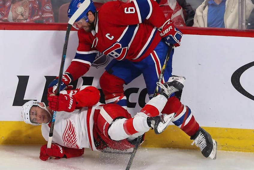  Canadiens’ Shea Weber takes down Red Wings’ Taro Hirose during October game at the Bell Centre.