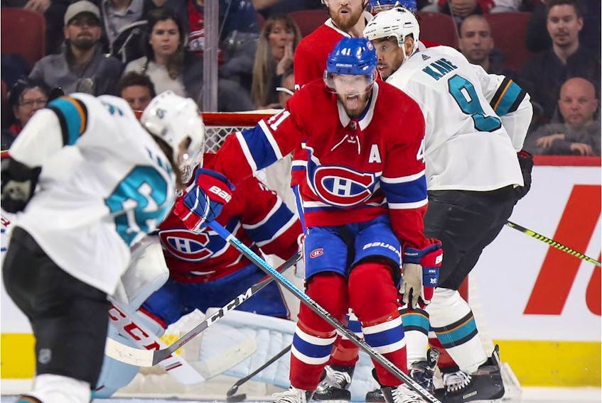  Montreal Canadiens winger Paul Byron tries to block shot by San Jose Sharks’ Erik Karlsson during second period in Montreal on Oct. 24, 2019. Canadiens’ Jeff Petry and Sharks’ Evander Kane watch at rear.