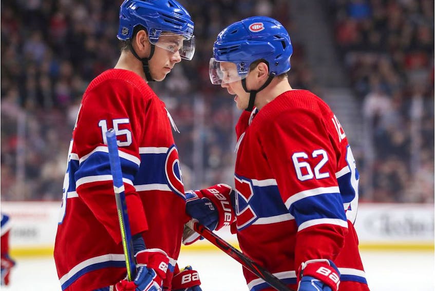  Montreal Canadiens’ Jesperi Kotkaniemi, left, and Artturi Lehkonen talk during a break in play against the San Jose Sharks in Montreal on Oct. 24, 2019.