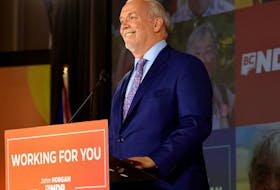 B.C. NDP leader John Horgan speaks at the party's provincial election night headquarters following a majority government win in Vancouver, British Columbia, Canada October 24, 2020.