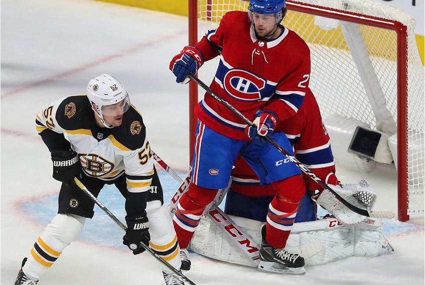  Montreal Canadiens centre Ryan Poehling gets between goaltender Carey Price and Boston Bruins’ Sean Kuraly during first period in Montreal on Nov. 5, 2019.