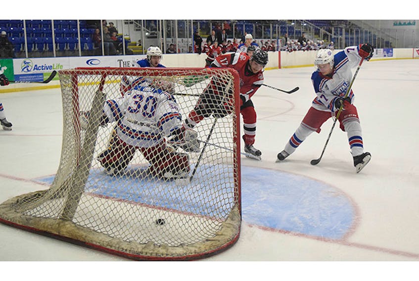 Pictou County Crushers’ co-captain Evan MacLennan scores a goal against the Summerside Western Capitals on Tuesday.