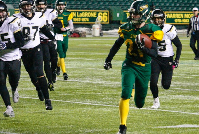 A player of the Fort Saskatchewan Sting pushes for the end zone during the Metro football high school championship game on Nov. 8, 2019, at Commonwealth Stadium.