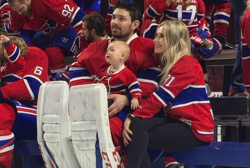 Canadiens goalie Carey Price poses with his wife, Angela, and their daughter, Liv Anniston, during Canadiens photo day at the Bell Centre in Montreal on March 27, 2017.     