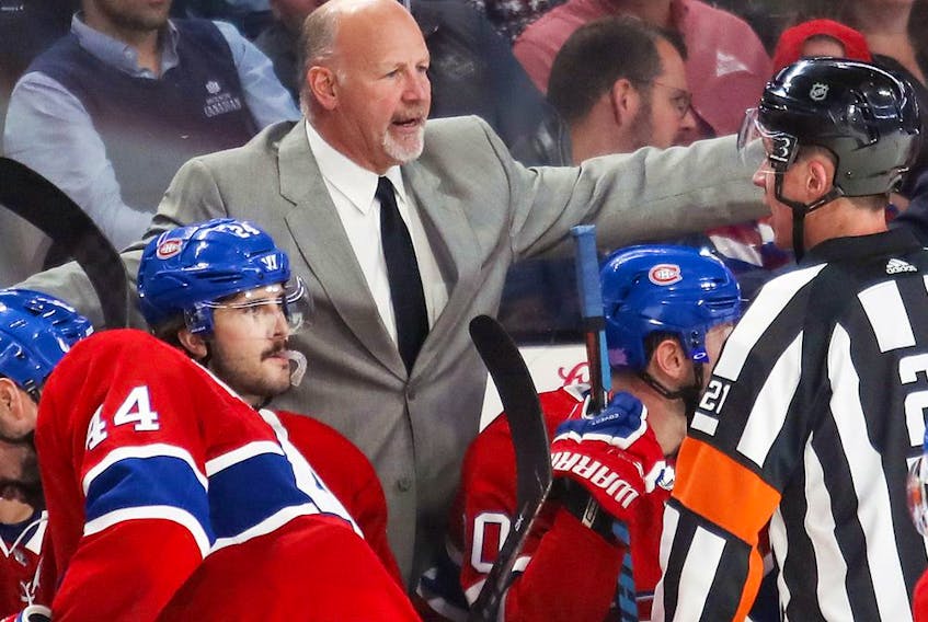 Canadiens coach Claude Julien discusses a penalty call with referee TJ Luxmore during third period of NHL        game at the Bell Centre in Montreal against the Ottawa Senators on Nov. 20, 2019.
