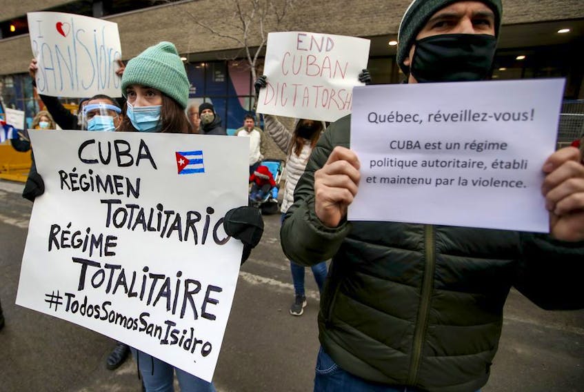 Protesters demonstrate in support of the Cuban San Isidro movement outside the TVA building in Montreal on Saturday, Nov. 28, 2020.