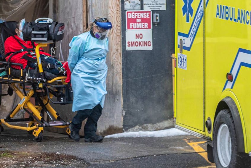 A resident is put into an ambulance at the rear of the Maimonides Geriatric Centre in Côte-St-Luc on Thursday, Nov. 26, 2020. The Family Advocacy Committee of Maimonides Geriatric Centre is calling for emergency measures to stop the spread of COVID-19 at the centre.  