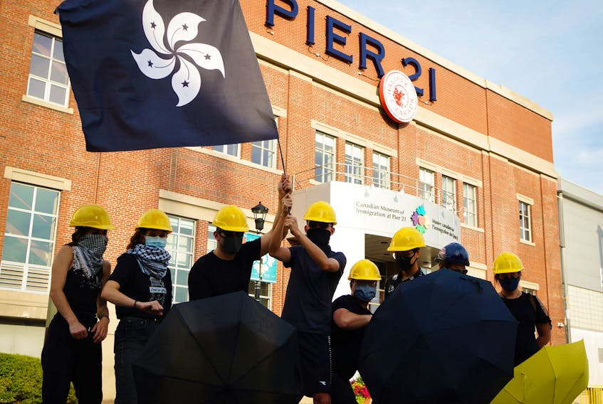 Protesters against the steady erosion of democratic freedoms in Hong Kong gather at Pier 21 in Halifax in the summer of 2020.