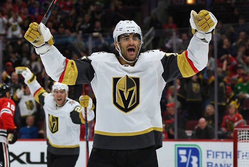 Max Paciorettyof the Vegas Golden Knights celebrates a goal by teammate Nick Holden during NHL game against the Chicago Blackhawks at the United Center on Oct. 22, 2019.