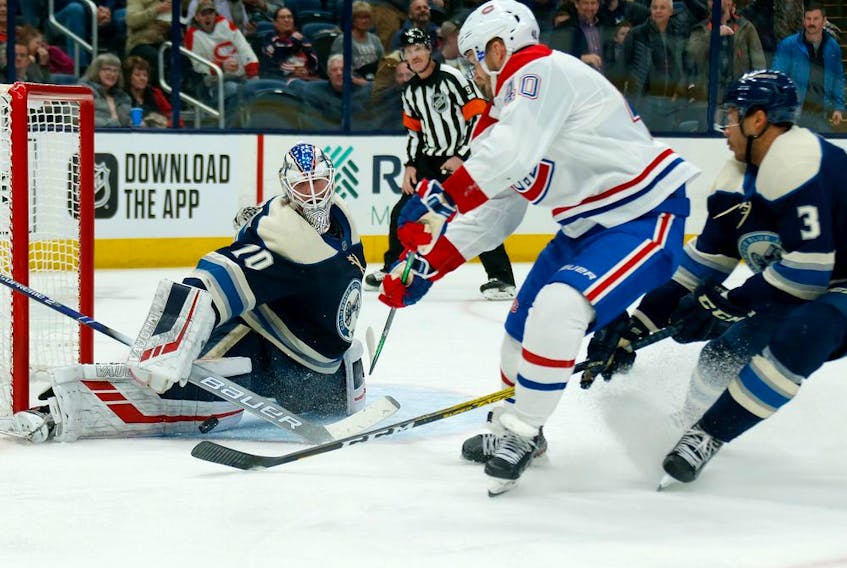  Blue Jackets goalie Joonas Korpisalo thwarts Canadiens’ Joel Armia during third period action in Columbus on Tuesday night.