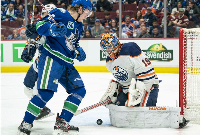 Brock Boeser #6 of the Vancouver Canucks looks for a rebound after goalie Mikko Koskinen #19 of the Edmonton Oilers made the save during NHL action at Rogers Arena on December 1, 2019 in Vancouver, Canada.