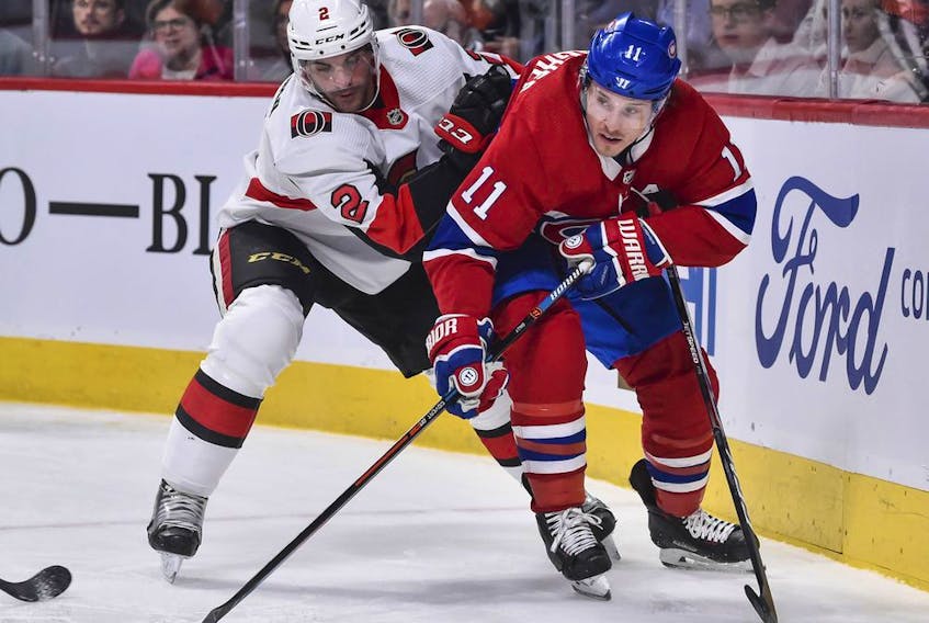 Dylan DeMelo battles against the Canadiens' Brendan Gallagher on Wednesday in Montreal. DeMelo broke a finger later in the game.