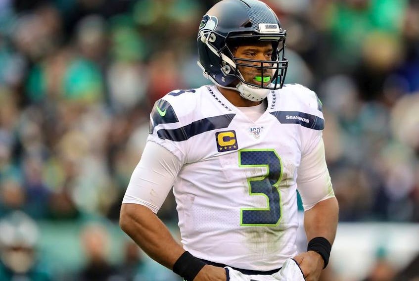 Russell Wilson of the Seattle Seahawks looks to the bench during a stop in play in the third quarter against Philadelphia Eagles at Lincoln Financial Field on November 24, 2019 in Philadelphia, Pennsylvania.