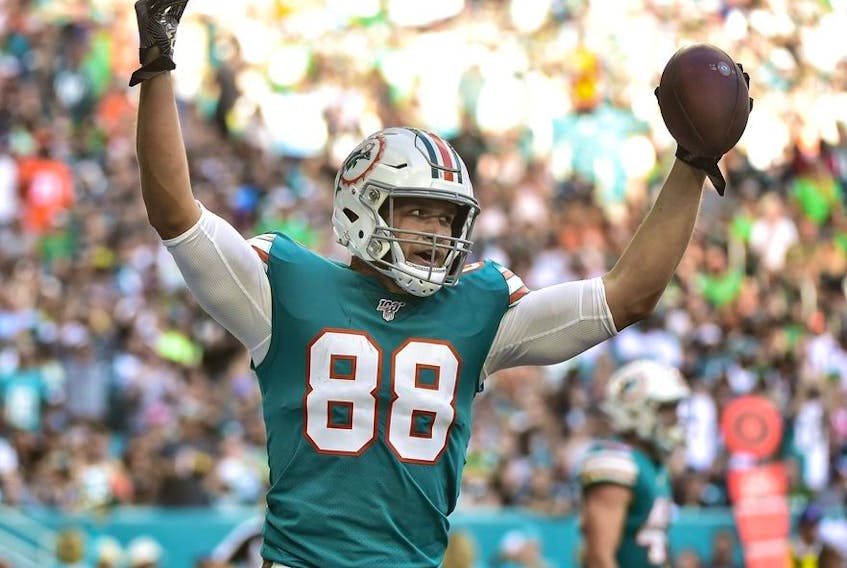 Mike Gesicki of the Miami Dolphins celebrates after scoring a touchdown in the third quarter against the Philadelphia Eagles at Hard Rock Stadium on December 1, 2019 in Miami, Florida.