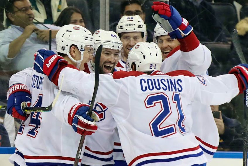 Canadiens' Nate Thompson (second from left) celebrates his game-winning goal at 18:53 of the third period against the New York Rangers at Madison Square Garden on Friday, Dec. 6, 2019, in New York City. The Canadiens defeated the Rangers 2-1.